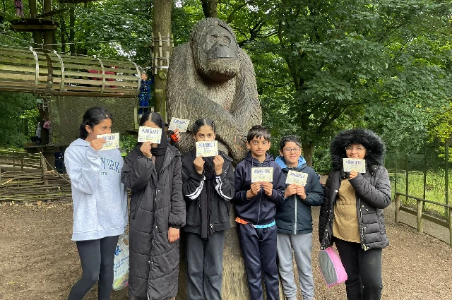 Six of our children stood in front of a monkey statue at Go Ape in Leeds