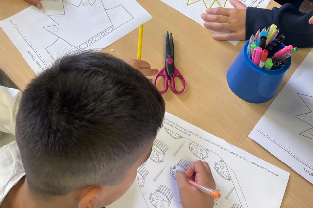 Our kids sat colouring and stenciling